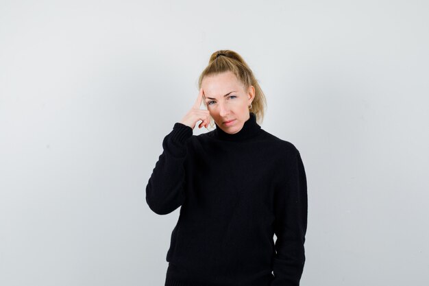 Expressive young woman posing in the studio