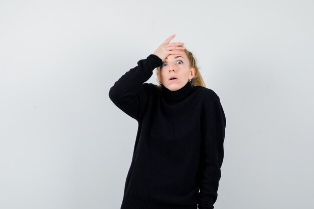 Expressive young woman posing in the studio