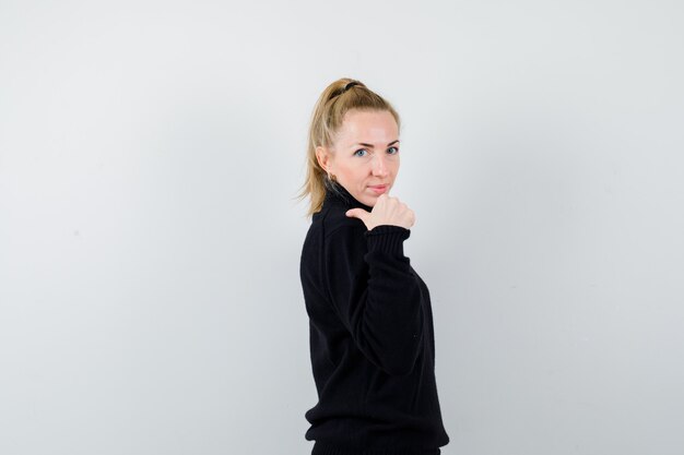 Expressive young woman posing in the studio