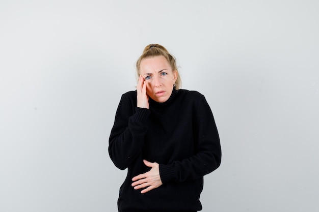 Expressive young woman posing in the studio