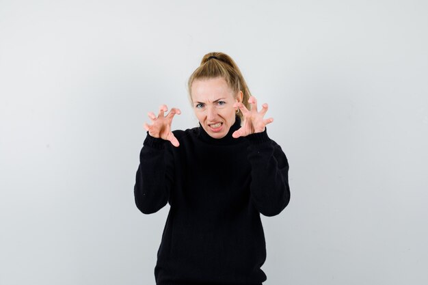 Expressive young woman posing in the studio