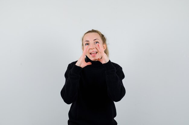 Expressive young woman posing in the studio