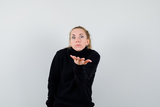 Expressive young woman posing in the studio