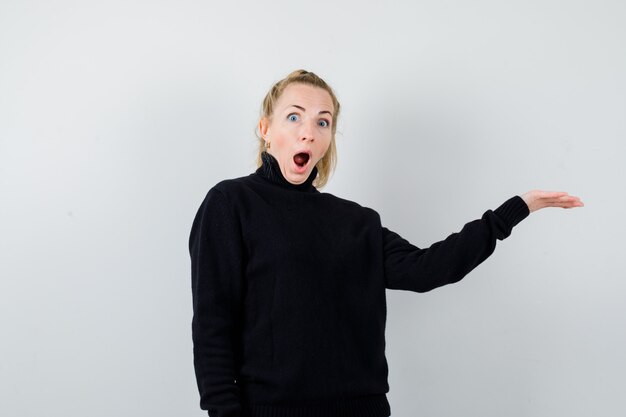 Expressive young woman posing in the studio