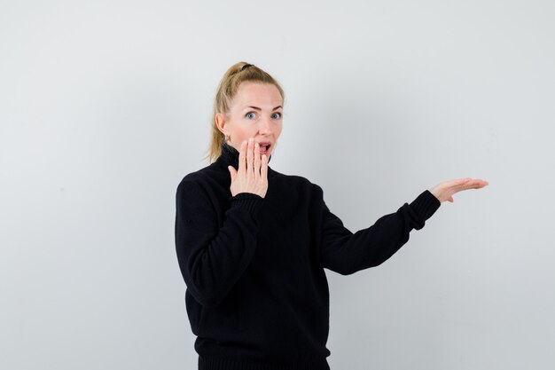 Expressive young woman posing in the studio