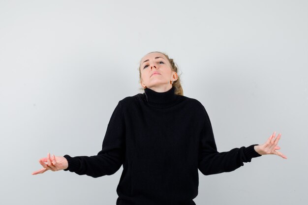 Expressive young woman posing in the studio