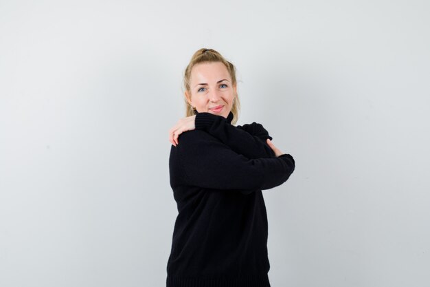 Expressive young woman posing in the studio