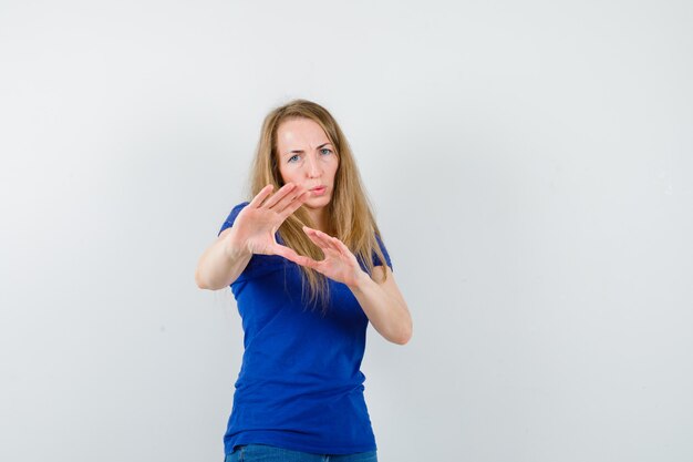 Expressive young woman posing in the studio