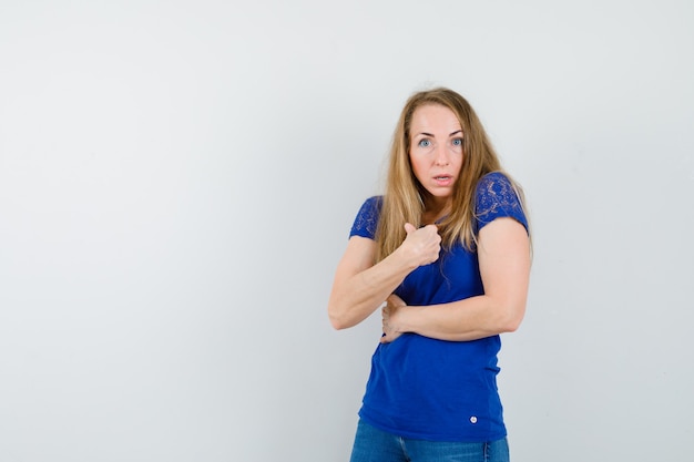 Expressive young woman posing in the studio