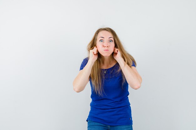 Expressive young woman posing in the studio