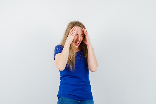 Expressive young woman posing in the studio