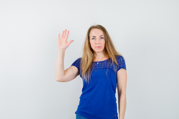 Expressive young woman posing in the studio