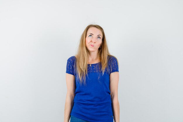 Expressive young woman posing in the studio