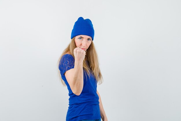 Expressive young woman posing in the studio