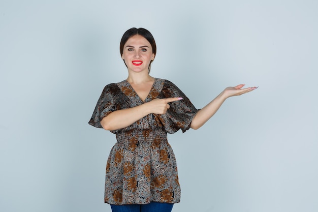 Expressive young woman posing in the studio