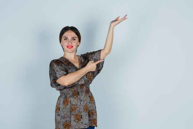 Expressive young woman posing in the studio