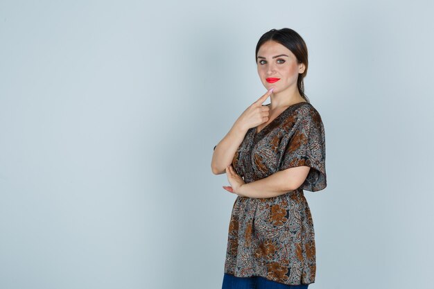 Expressive young woman posing in the studio