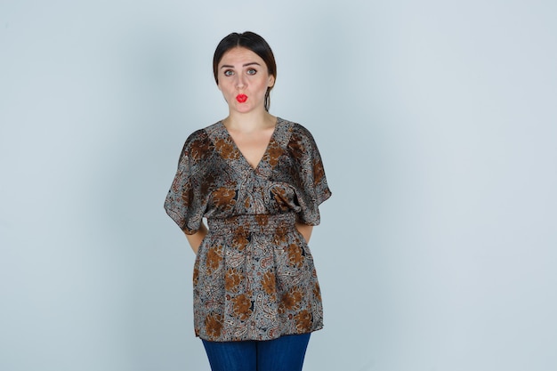 Expressive young woman posing in the studio