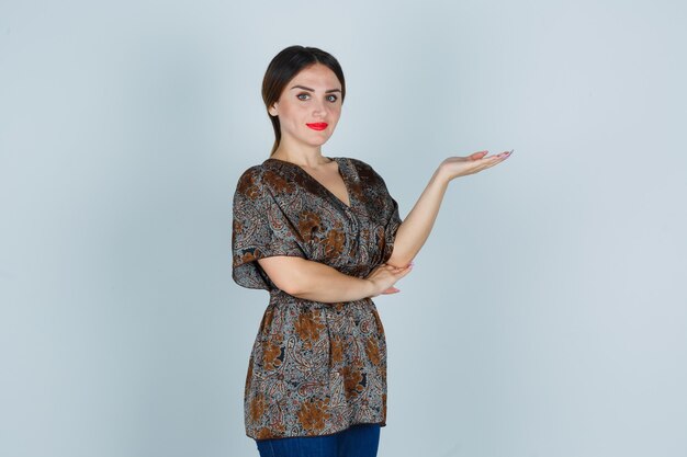 Expressive young woman posing in the studio