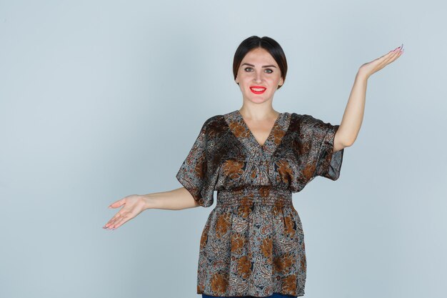 Expressive young woman posing in the studio