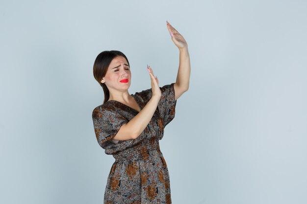 Expressive young woman posing in the studio