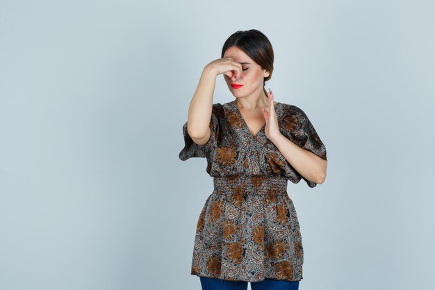 Expressive young woman posing in the studio