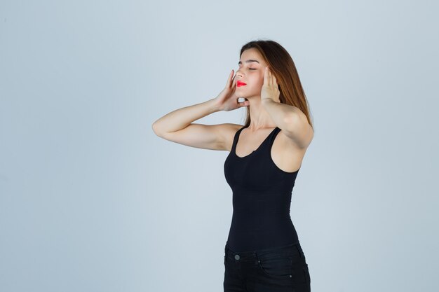 Expressive young woman posing in the studio