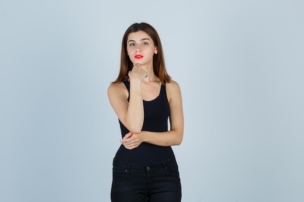 Expressive young woman posing in the studio