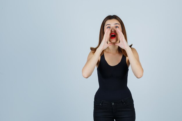 Expressive young woman posing in the studio