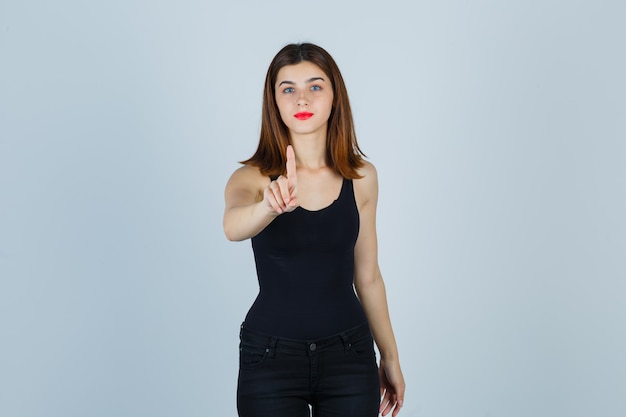 Expressive young woman posing in the studio