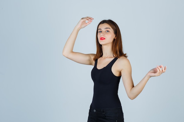 Expressive young woman posing in the studio