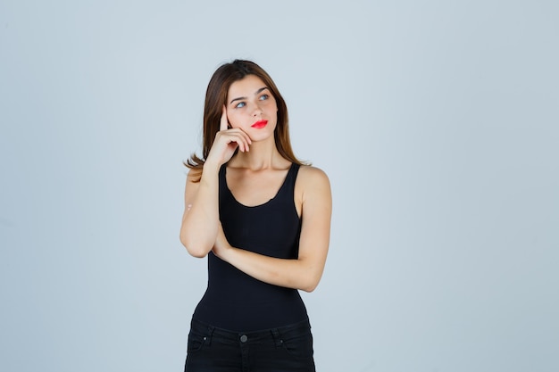 Expressive young woman posing in the studio