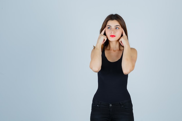 Expressive young woman posing in the studio