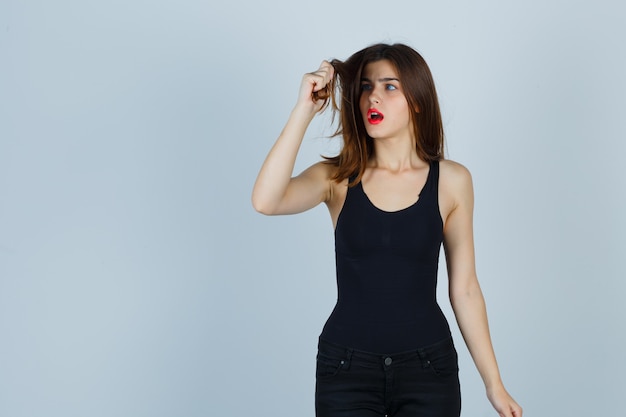 Expressive young woman posing in the studio