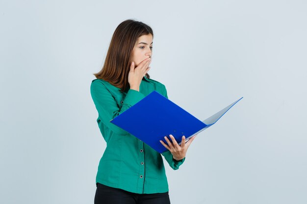 Expressive young woman posing in the studio