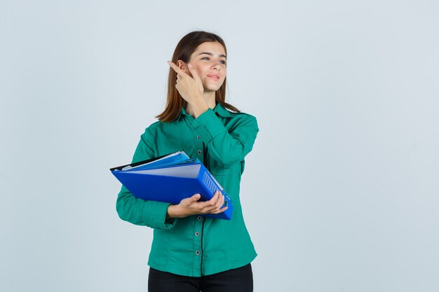 Expressive young woman posing in the studio