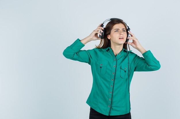 Expressive young woman posing in the studio