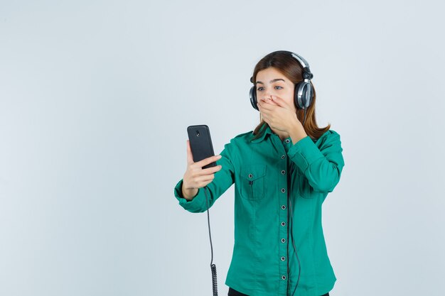 Expressive young woman posing in the studio