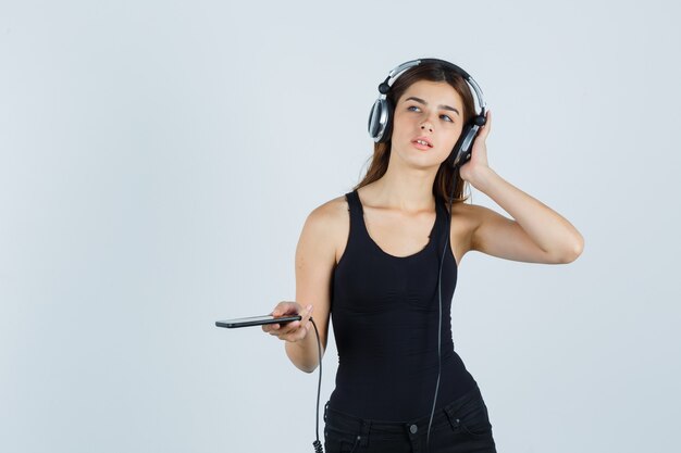 Expressive young woman posing in the studio