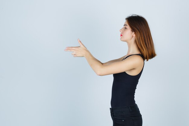 Expressive young woman posing in the studio