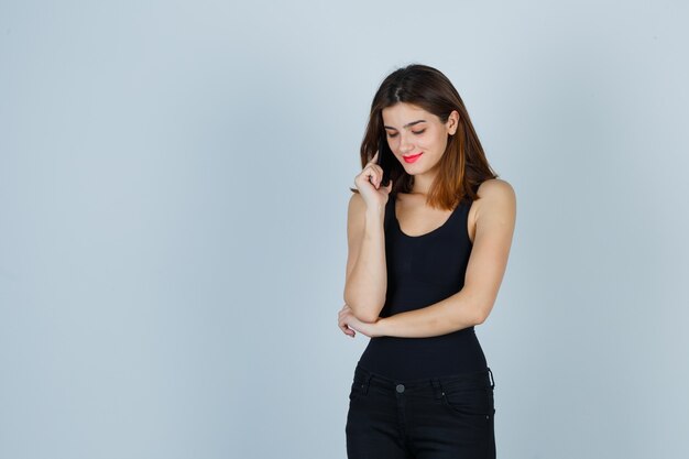 Expressive young woman posing in the studio