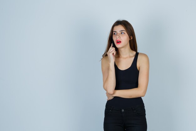 Expressive young woman posing in the studio