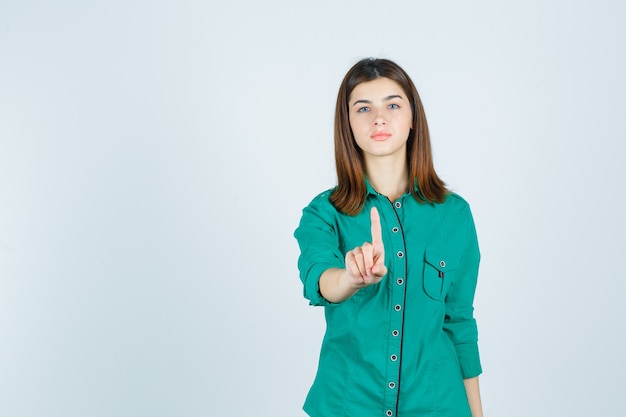 Expressive young woman posing in the studio