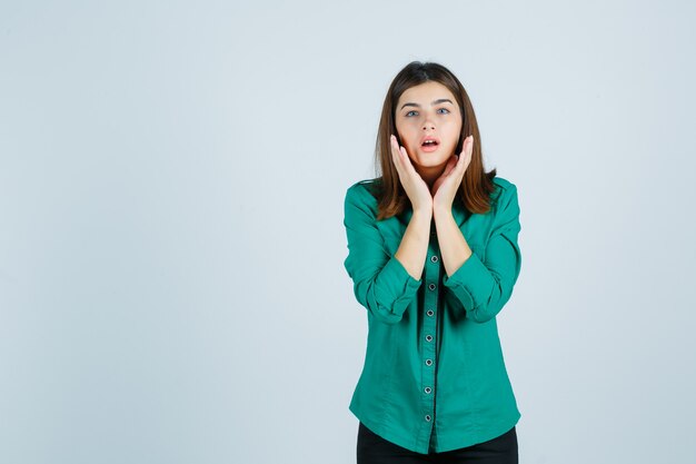 Expressive young woman posing in the studio