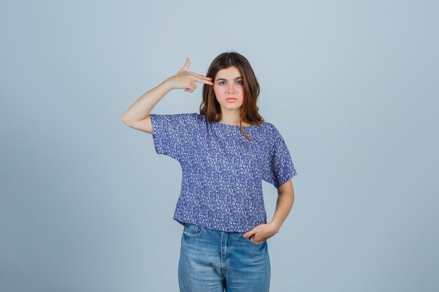 Expressive young woman posing in the studio