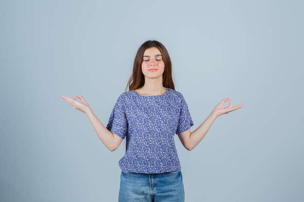 Expressive young woman posing in the studio