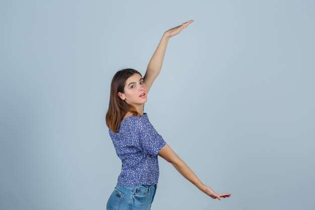 Expressive young woman posing in the studio