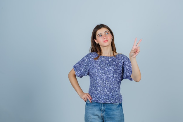 Expressive young woman posing in the studio