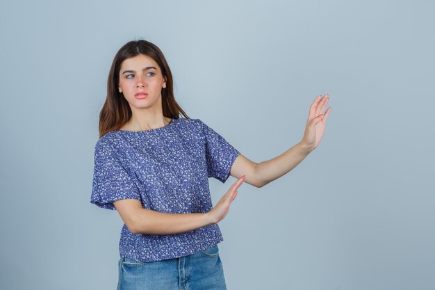 Expressive young woman posing in the studio