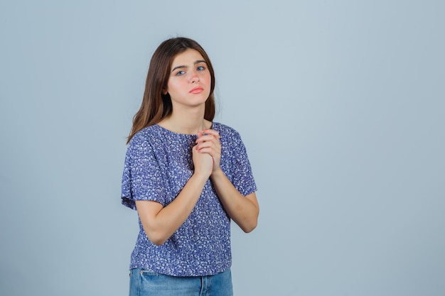 Expressive young woman posing in the studio